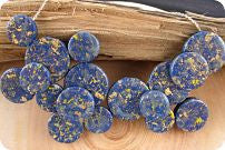 A blue, flecked with gold statement...Lapis... I wonder???